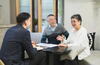 Senior couple meeting with advisor in office